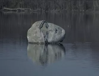 Н.